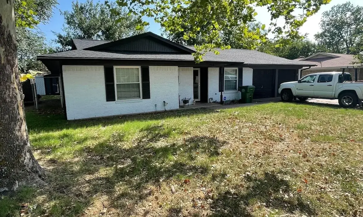 Professional roofing crew working on a residential roof in Pompey